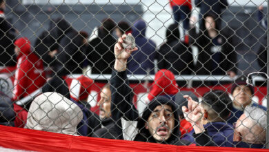 Ten hurt, 90 arrested as match abandoned following fan violence in ...