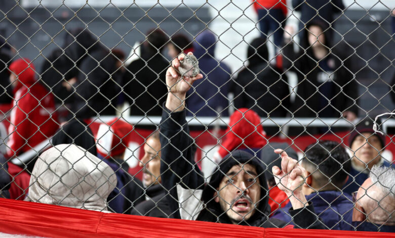 Ten hurt, 90 arrested as match abandoned following fan violence in ...