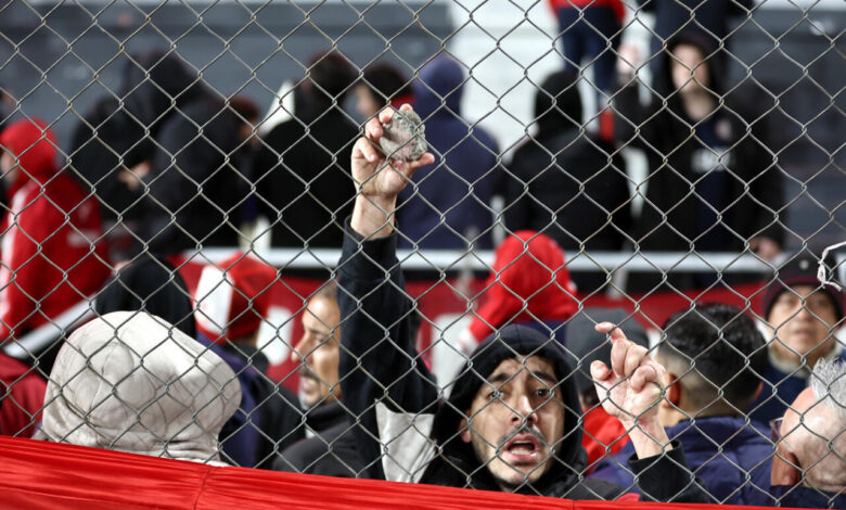 Ten hurt, 90 arrested as match abandoned following fan violence in ...