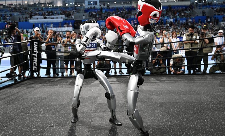 Humanoid robots race and tumble at China's first 'robot Olympics ...