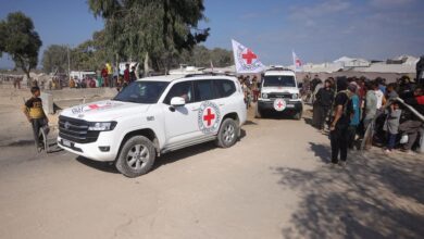 Hamas returns 4 hostages' bodies after Israel threatens aid cut